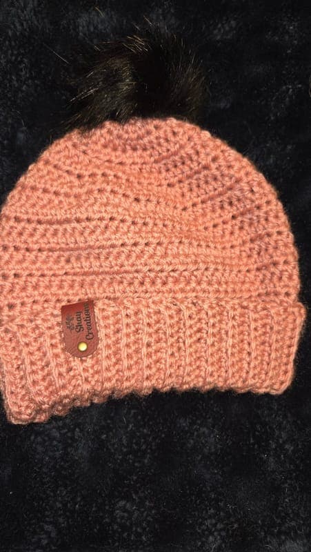 Beautiful rose colored beanie with removable snap on pom pom